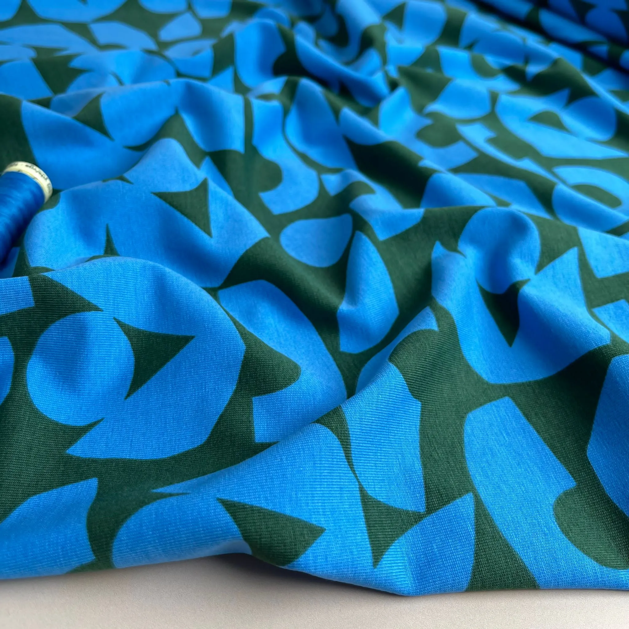 Blue Shapes on Khaki Combed Cotton Jersey Fabric