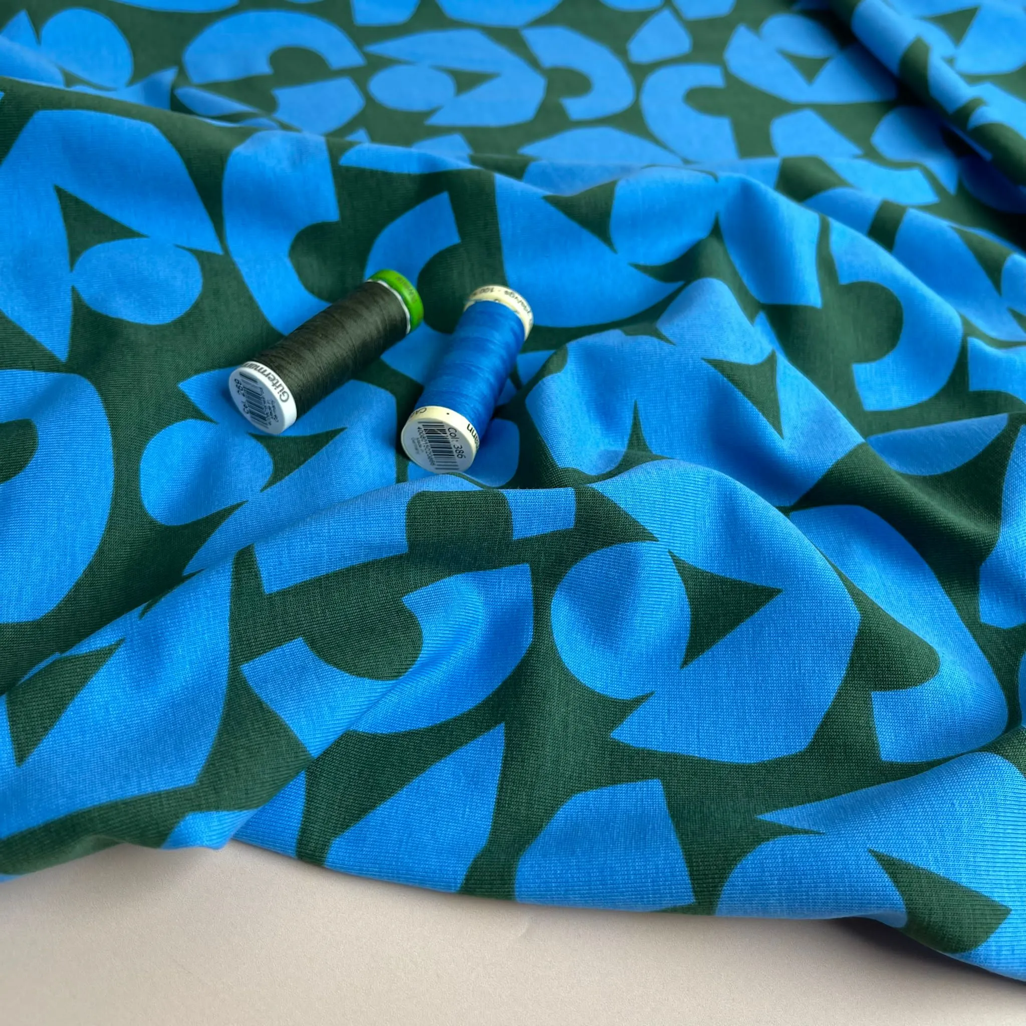 Blue Shapes on Khaki Combed Cotton Jersey Fabric